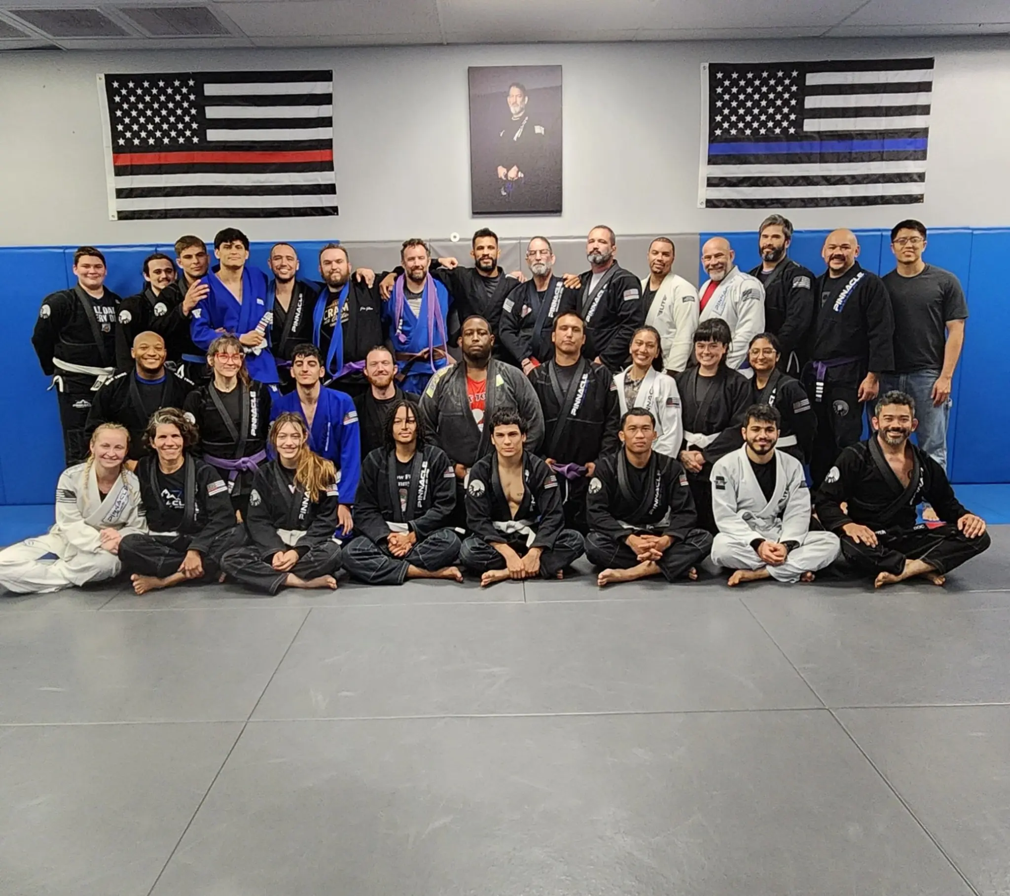 The whole Pinnacle BJJ team gathered on the mats for a group photo